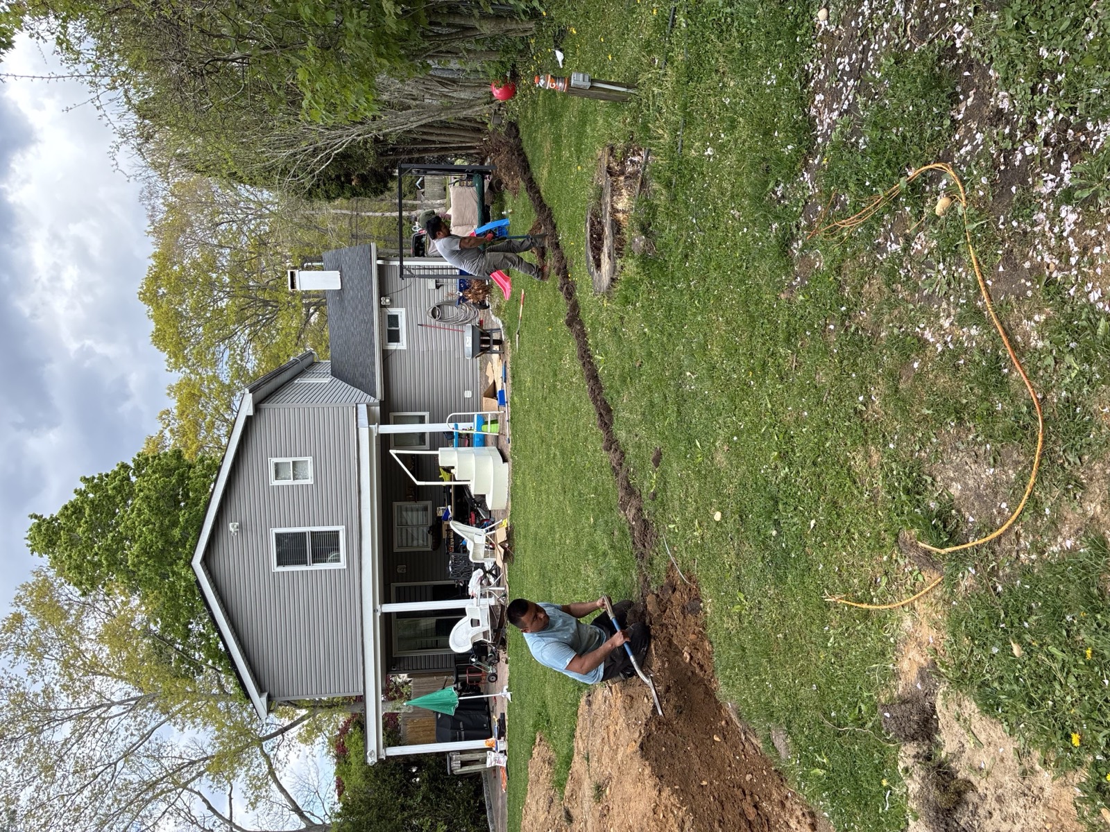 New irrigation lines trenched across a backyard installation